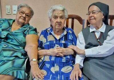 On her 114th birthday, along with her 91-year-old sister, Salete (left), and her 91-year-old daughter, Sister Iolanda Beltrão (right).