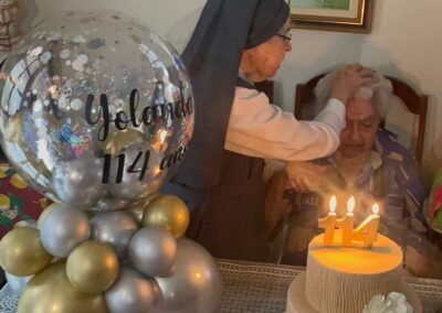 On her 114th birthday, with her daughter.