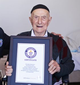 Israel Kristal receiving his certificate as World's Oldest Man at age 112. Credit: Guinness World Records