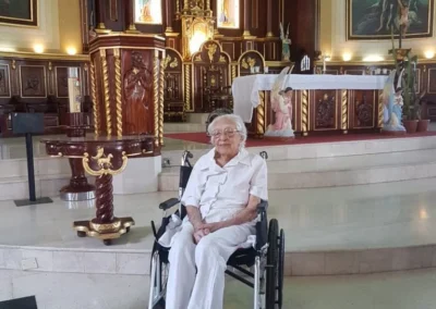On 17 March 2019, aged 112, visiting the church where she got married and was baptized. (Source: The 110 Club)