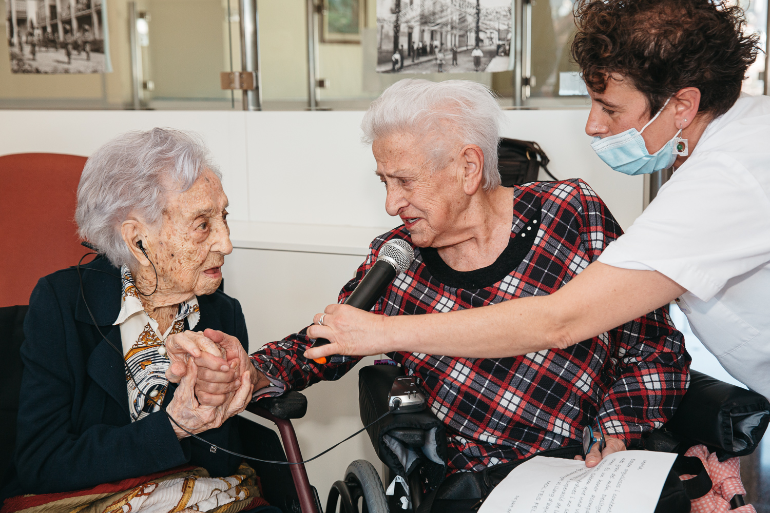 María Branyas Morera is toasted by a fellow resident during her 116th birthday party.