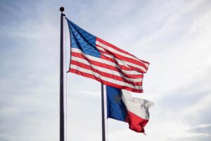Flag of the United States alongside the flag of Texas