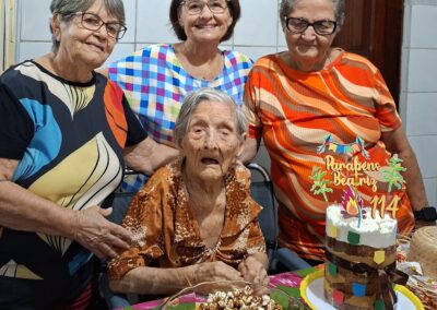 On her 114th birthday in June 2025, with her three surviving daughters.