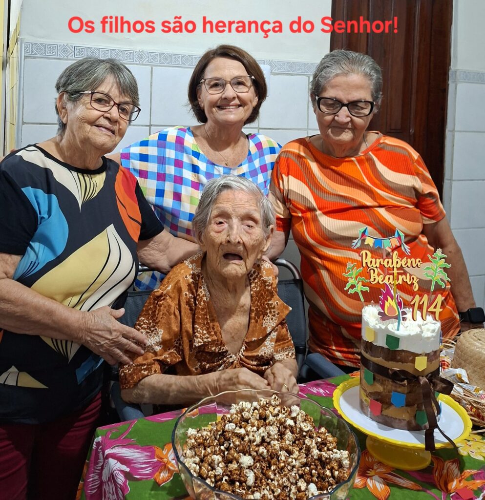 On her 114th birthday in June 2025, with her three surviving daughters.