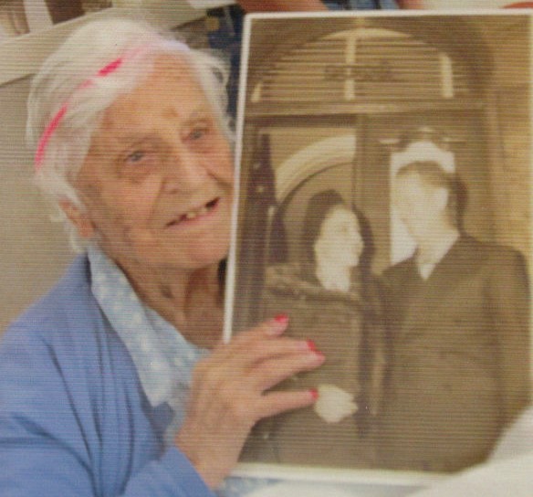 At the age of 105, holding a picture from her wedding day in 1939. (Source: Royal Suites Healthcare and Rehabilitation)
