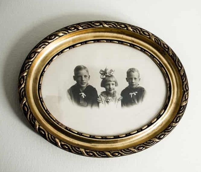 As a child (left), with his two younger siblings. (Photo credit: Kristian Isaksen/Fyens Stiftstidende)