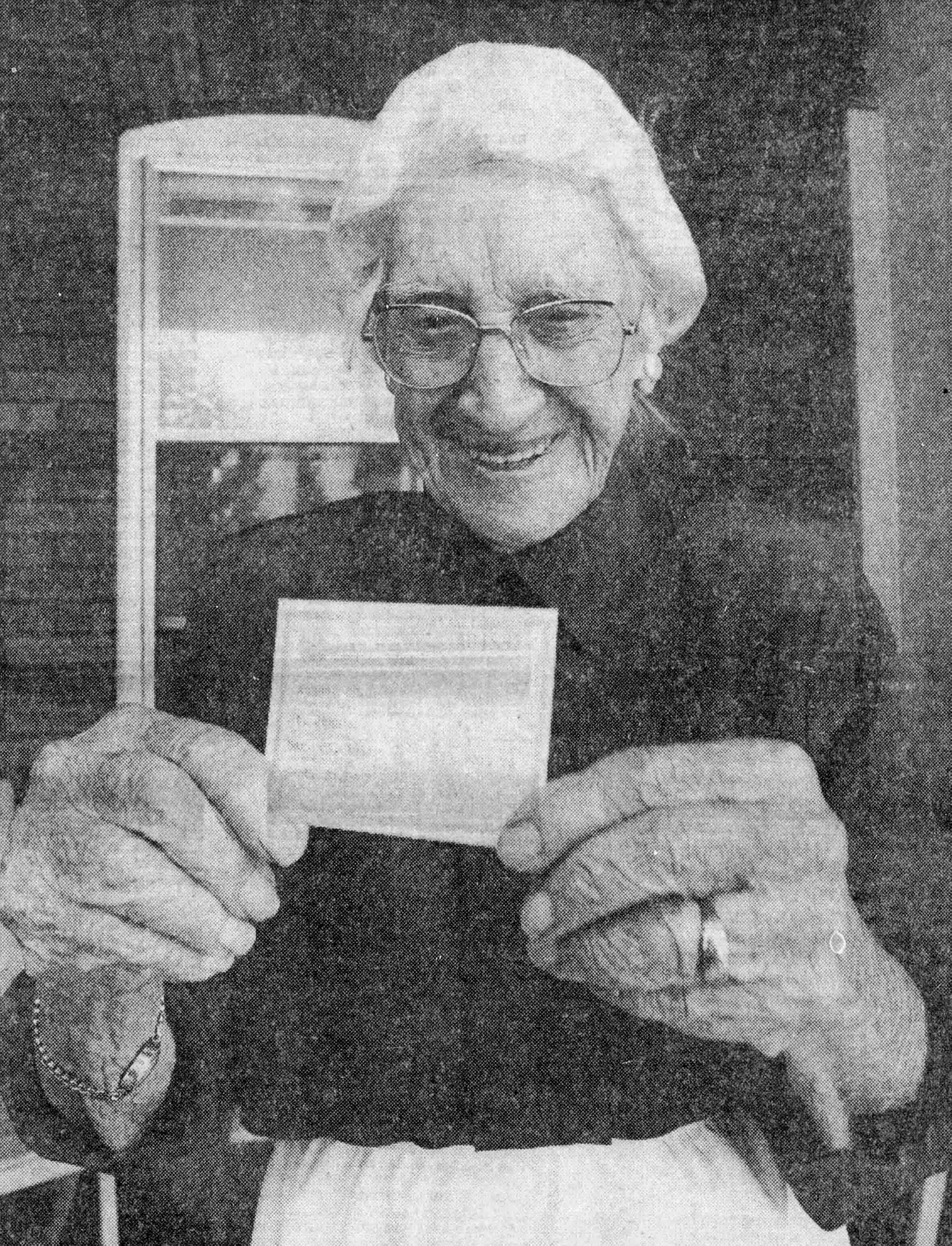 On her 110th birthday, holding a copy of her birth certificate. (Source: The Toronto Star)
