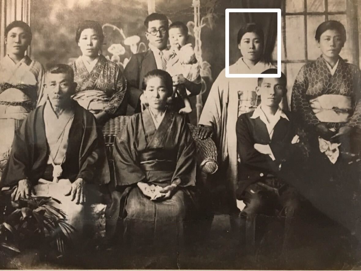 At the age of 25, with her parents, siblings, and a niece. (Source: Courtesy of the family)