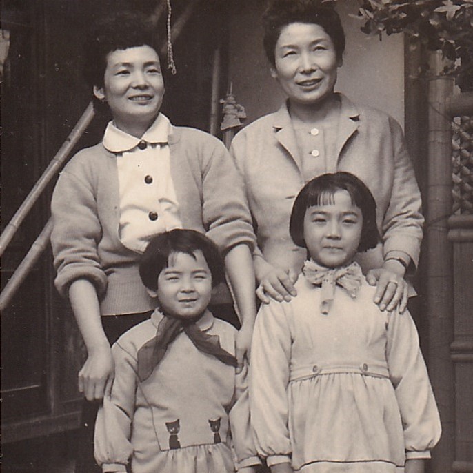 In the 1950s, with her sister and nieces. (Source: Courtesy of her eldest son, Mr. Ichirō Honda.)