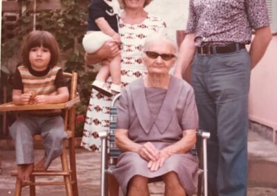 Aged 59, with her mother Joana, and 2 grandchildren. (Source: Courtesy of the family)