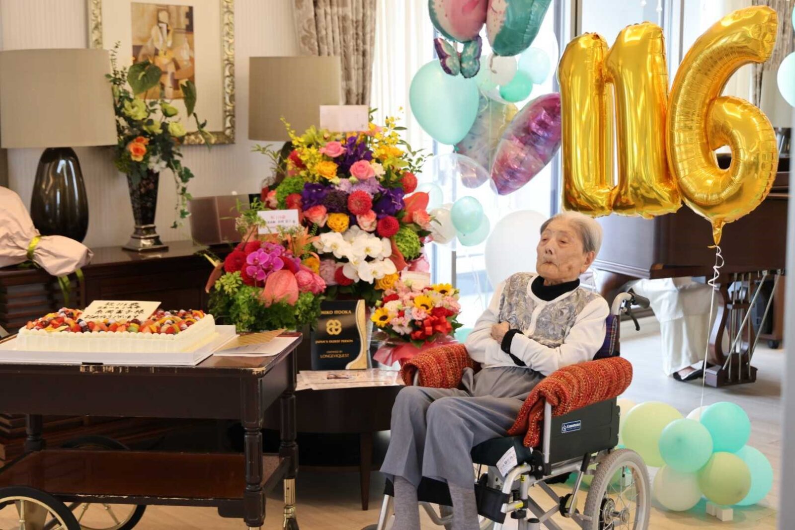 Tomiko Itooka awaiting her guests at her 116th birthday party. Photo by LongeviQuest.