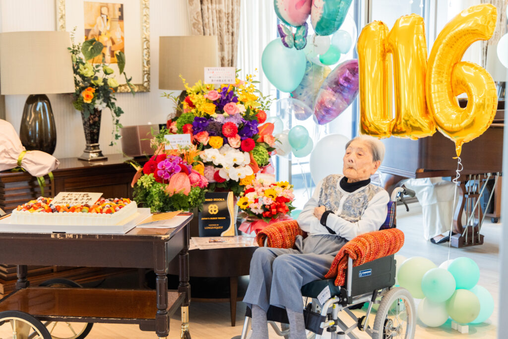 Tomiko Itooka awaiting her guests at her 116th birthday party. Photo by LongeviQuest.