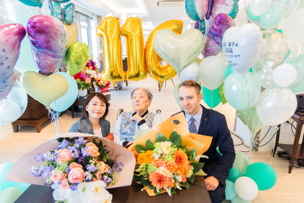 Yumi Yamamoto, Tomiko Itooka, and Jack Steer at Itooka-san's 116th birthday party. Photo by LongeviQuest.