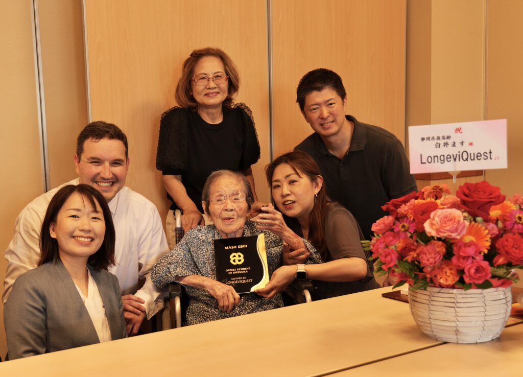 Masu Usui with her granddaughter Yukiko Nakamura, other family members, and LongeviQuest representatives Yumi Yamamoto and Ben Meyers