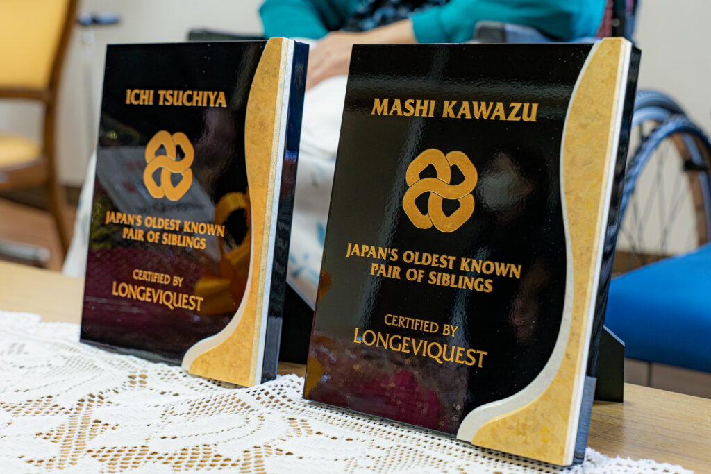 LongeviQuest plaques honoring Ichi Tsuchiya, 108, and Mashi Kawazu, 105, Japan's oldest known sisters