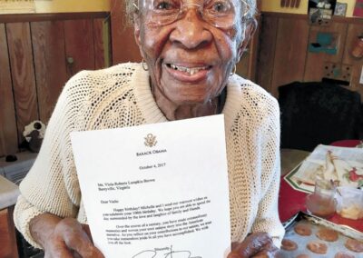 At the age of 106, holding a signed letter from former President Barack Obama. (Source: The Winchester Star)