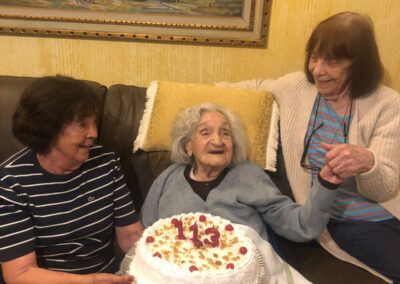 On her 113th birthday, with her daughters.