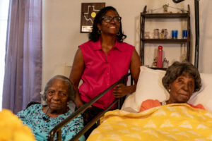 Elizabeth Francis (1909-2024) with her granddaughter Ethel Harrison and daughter Dorothy Williams &copy; LongeviQuest