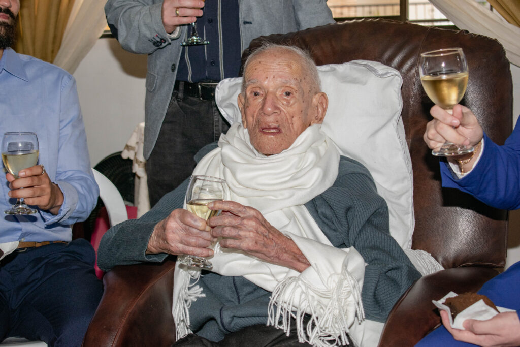 Efraín Antonio Ríos García, oldest Colombian man ever, enjoying a drink at age 113. © LongeviQuest
