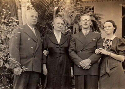 On her wedding day in 1937, with her husband and her parents.