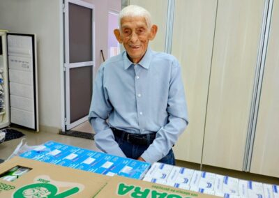 In early May 2025, donating milk cartons to children.
