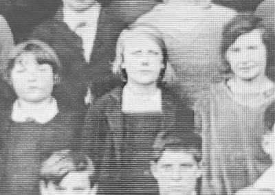 As a young girl in school. (Source: YouTube / The 100 Project)