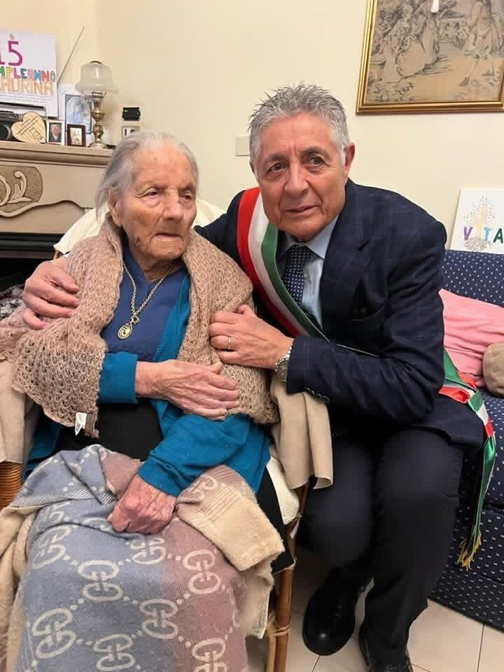 Lucia Laura Sangenito, oldest living Italian person, on her 115th birthday with Mayor Vito Di Leo.