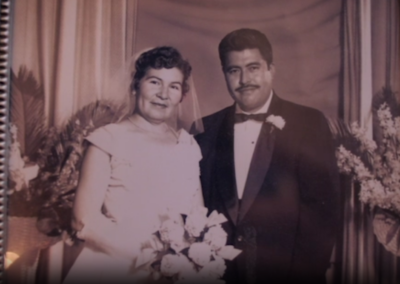 With her husband. (Source: SCAN Health Plan)