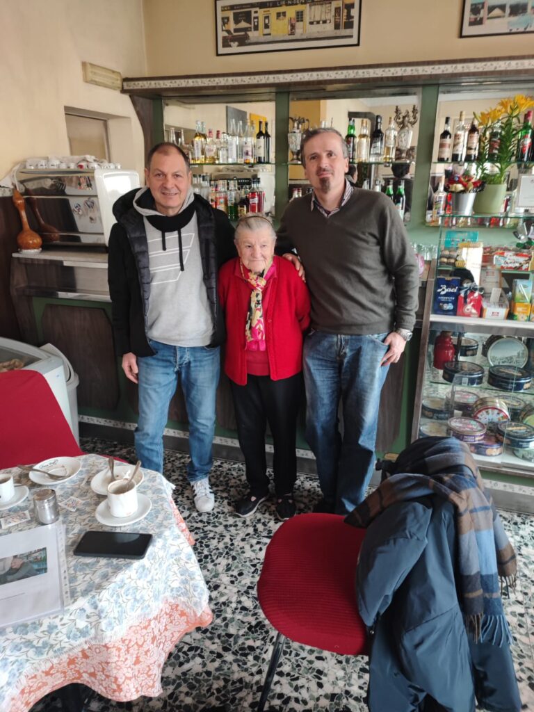 Anna Possi, 101, with researchers Tiziano Gaudino (left) and Alessandro Delucchi (right).