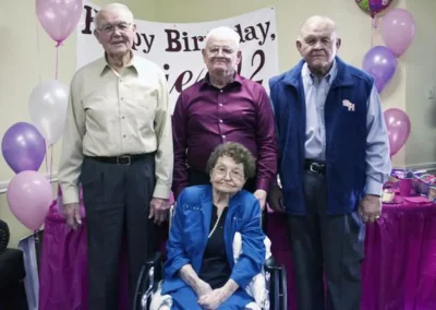 On her claimed 112th (more likely 111th) birthday in 2014, along with her sons, Joe, 88, left; Finis, 90; and Jeff, 83, right. (Source: chron.com)