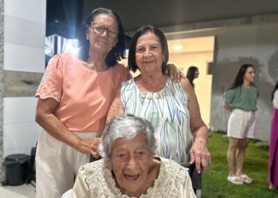 Celebrating her 107th birthday, with her two daughters.