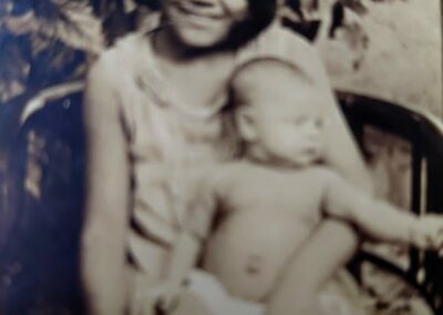 At age 12, with her first niece Maria Etelvina.