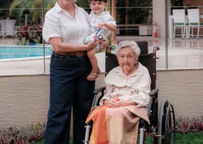 On her 108th birthday, with her daughter, Dr. Maria Goretti, and her great-grandson.