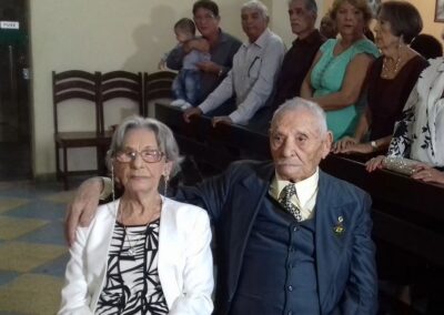 On his 100th birthday, at Mass with his wife Carmelita Alves de Araújo, age 93.