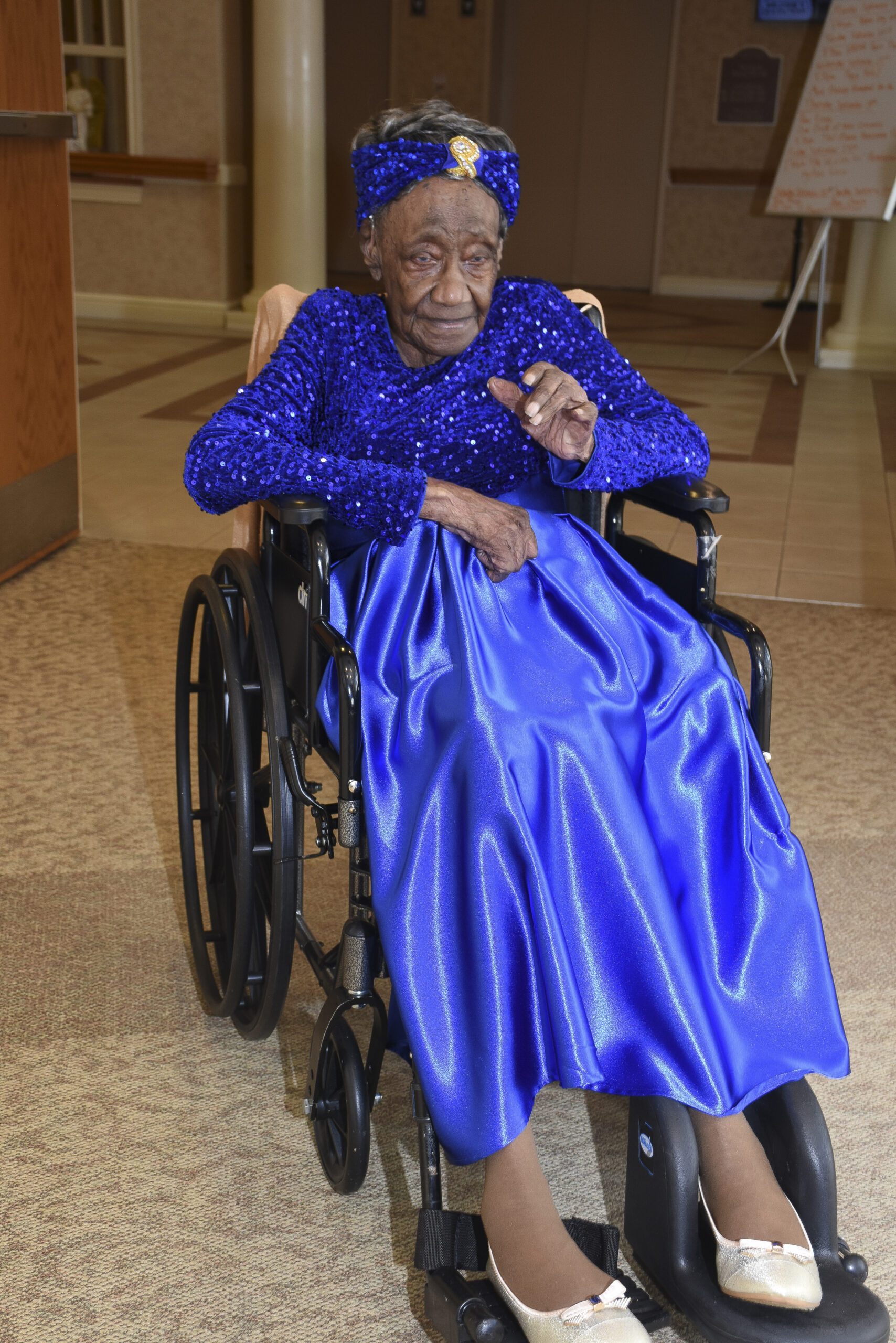 Naomi Whitehead greetings guests at her 116th birthday party.