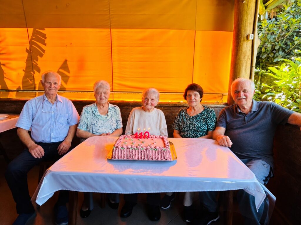 With her four children.