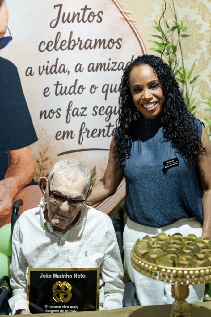 Jo&atilde;o Marinho Neto, with LongeviQuest representative, Iara Souza.